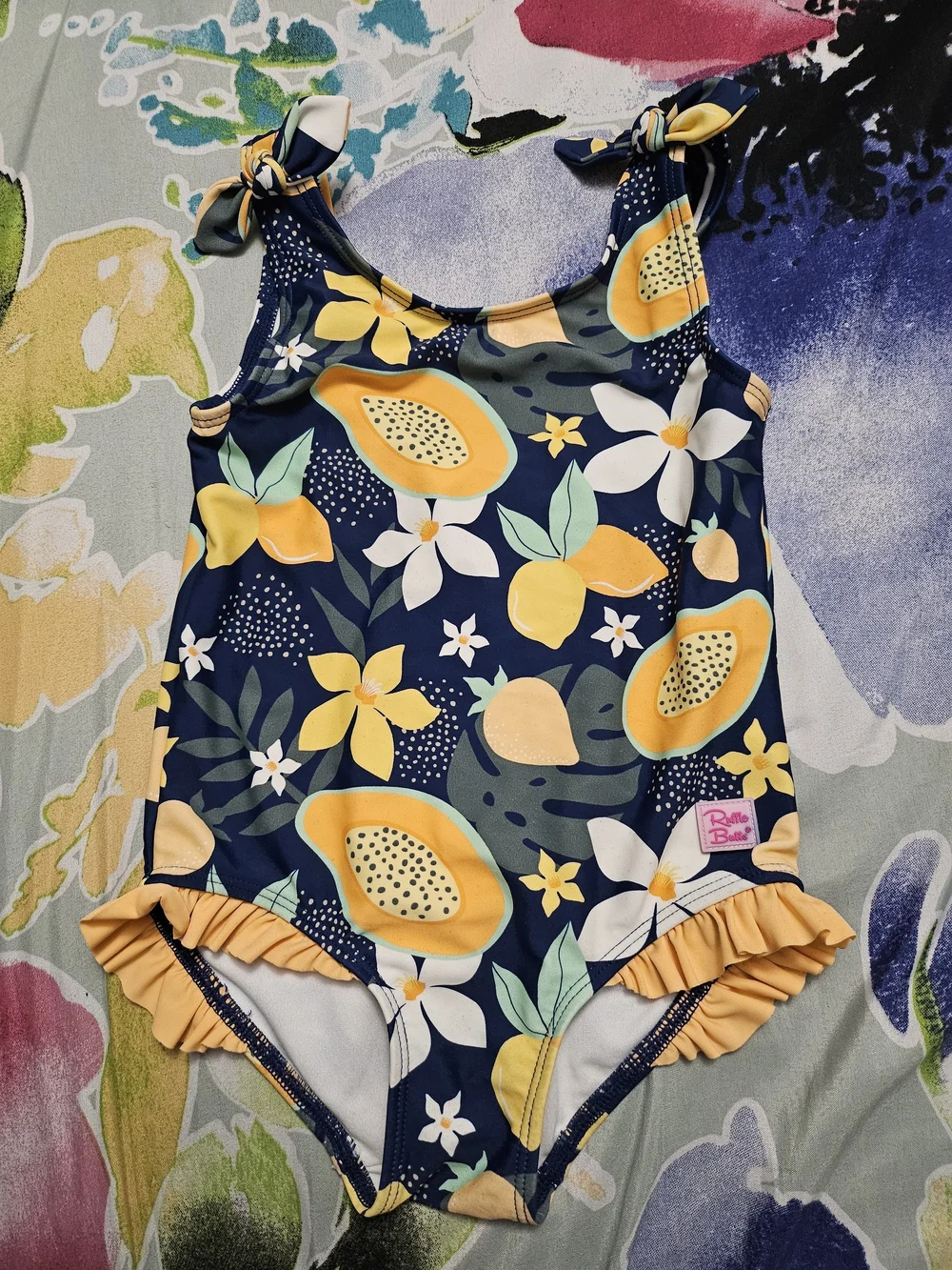 Ruffle Butts Navy One-Piece Swimsuit with Yellow Fruit Print